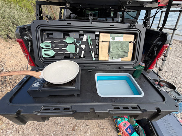 Truck bed camp kitchen setup with VOZ portable kitchen on a tailgate