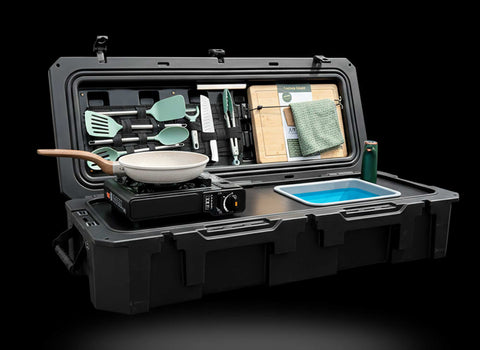 Portable outdoor kitchen set in a black case with cookware and utensils.