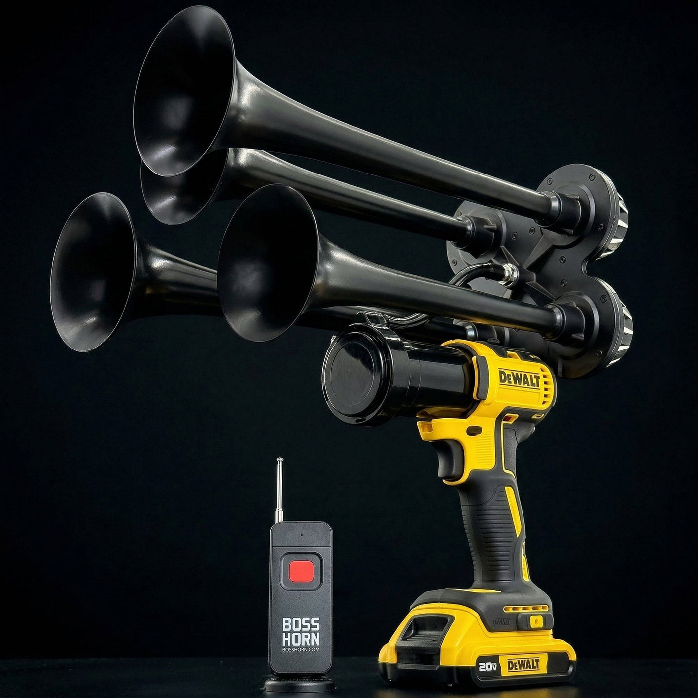 Black four-trumpet wildlife deterrent camp horn with wireless remote on a dark background