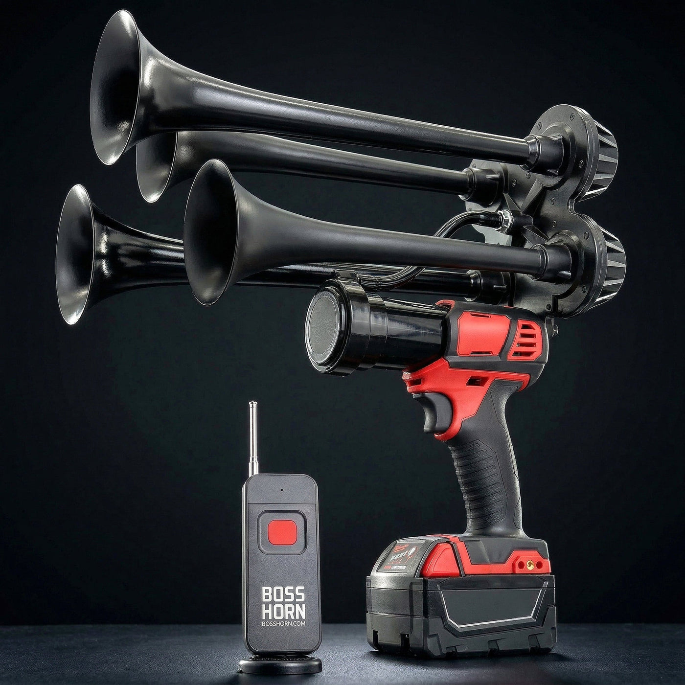 Black four-trumpet wildlife deterrent camp horn with wireless remote on a dark background